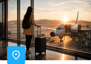 Traveller with a suitcase watching an aircraft board at an airport gate
